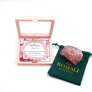ROMALI Rose Quartz bracelet in a pink box with a natural rose quartz stone and branded pouch for emotional healing.