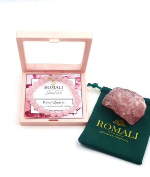 ROMALI Rose Quartz bracelet in a pink box with a natural rose quartz stone and branded pouch for emotional healing.