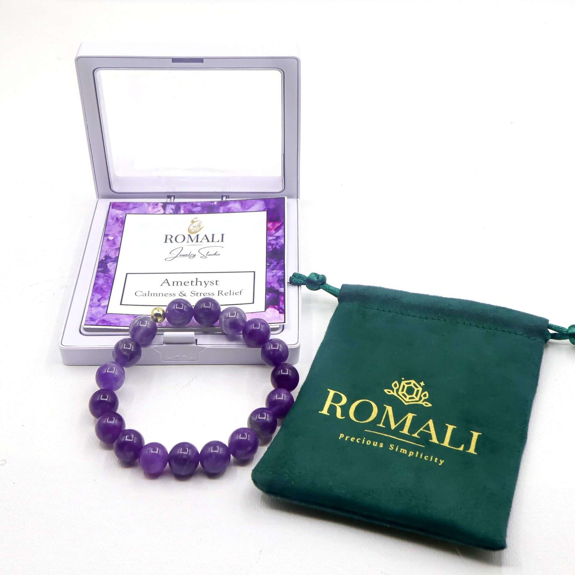 ROMALI 18K gold-plated natural amethyst beaded bracelet in packaging and pouch, promoting calmness and emotional balance.