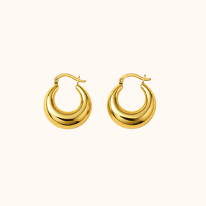 Gold hoop earrings on a white background