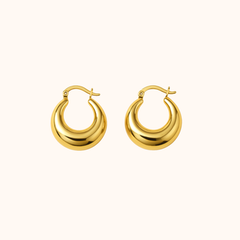 Gold hoop earrings on a white background